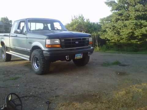 1994 Ford F-150 - This 1994 Ford F-150 pickup truck is shown from a three-quarter front angle.