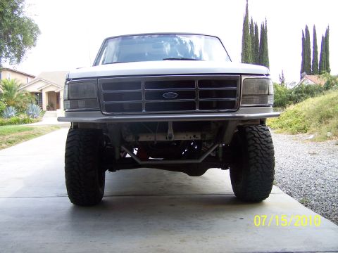 1995 Ford Bronco - Front view of a 1995 Ford Bronco, modified with an aftermarket bumper and off-road tires.
