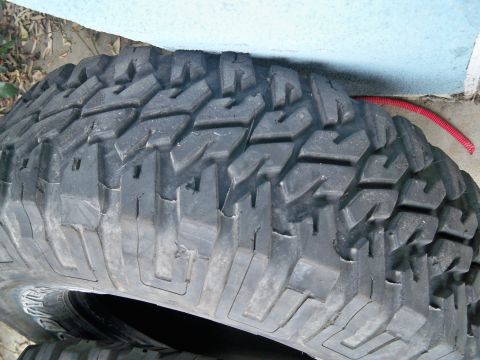 1985 Ford Bronco - Tire tread detail, likely for an off-road vehicle.