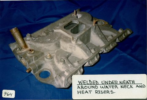 1973 Ford Mustang - An aluminum intake manifold is shown with a water neck attachment and visible heat risers.