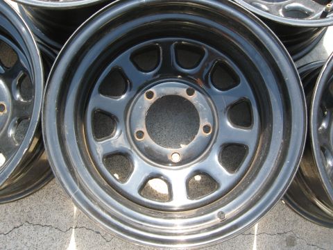 1986 Ford Bronco - A collection of black steel wheels is displayed, with a watermark for SuperMotors.net visible.