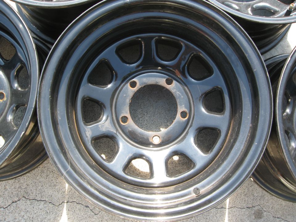 Several black steel wheels stacked together