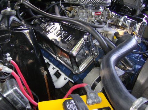 1970 Ford Ranchero - Close-up of an engine bay showing chrome valve covers and battery terminals.