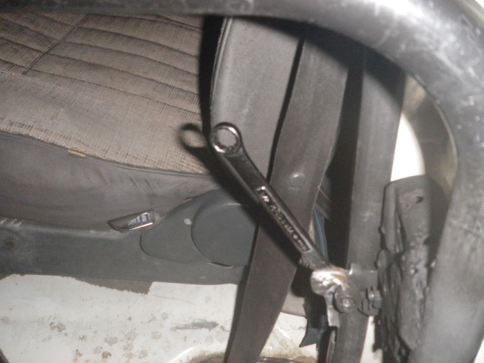 Wrench on interior trim of a vehicle