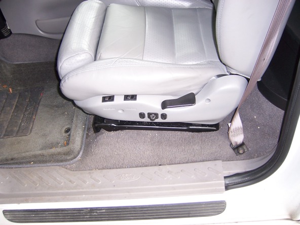 Passenger seat with power controls and seatbelt in a vehicle