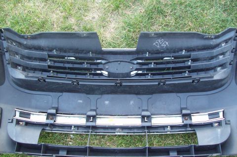 2006 Ford Fusion - Front bumper and grille assembly, possibly from a Ford vehicle, with handwritten markings on the upper section.