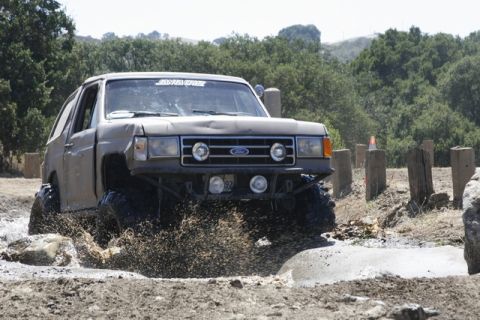 1989 Ford Bronco - This 1989 Ford Bronco navigates a muddy obstacle during an off-road event.
