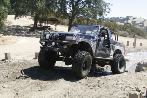 1989 Ford Bronco - This heavily modified SUV is equipped for off-road use with a custom bumper and roll cage.