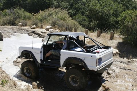 1989 Ford Bronco - This classic 1989 Ford Bronco tackles a challenging off-road trail with its doors removed.