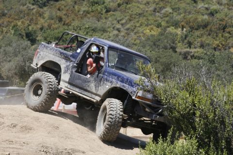1989 Ford Bronco - Modified 1989 Ford Bronco tackling an off-road trail.