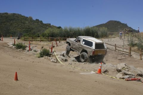 1989 Ford Bronco - This 1989 Ford Bronco tackles a rocky section of an off-road course during a competition.