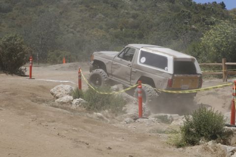 1989 Ford Bronco - Ford Bronco tackling an off-road obstacle course.