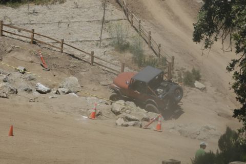 1989 Ford Bronco - Off-road vehicle tackles a challenging course marked with cones and tape.
