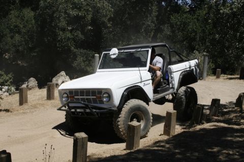 1989 Ford Bronco - This classic Ford Bronco is navigating a challenging off-road course.