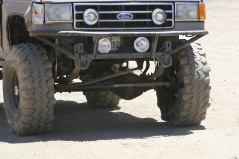1989 Ford Bronco - This Ford Bronco features a custom bumper and aggressive tires, suggesting off-road modifications.