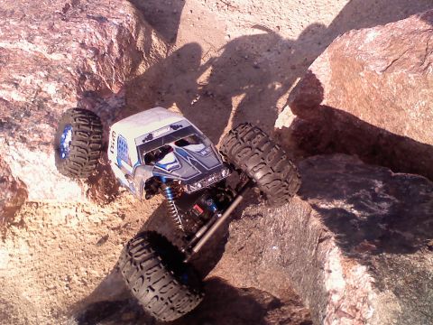 1996 Ford Bronco - Remote control rock crawler navigating a challenging rocky obstacle course.