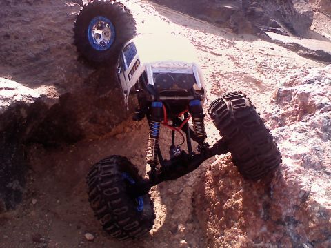 1996 Ford Bronco - This remote-controlled rock crawler is navigating a challenging rocky terrain.