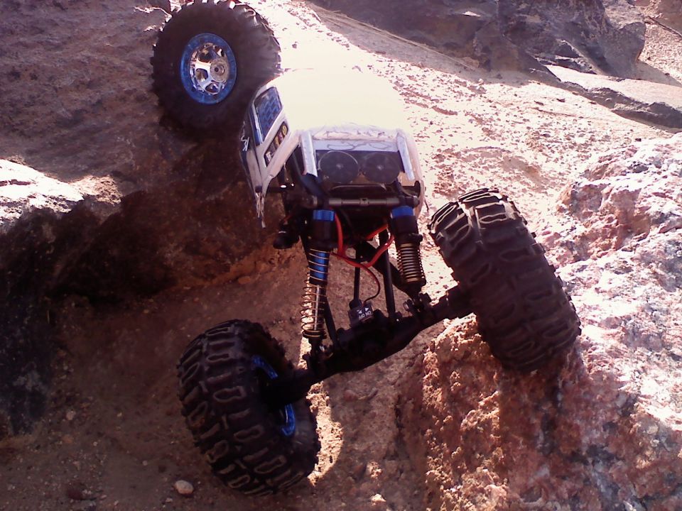 RC rock crawler climbing over rocks