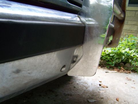 1989 Ford Bronco - Close-up of the front bumper corner on a 1989 Ford Bronco, showing chrome and black trim details.