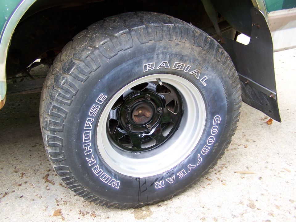 Wheel and tire with "WORKHORSE" and "GOOD YEAR RADIAL" text