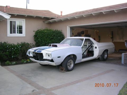1972 Ford Ranchero - This 1972 Ford Ranchero is undergoing restoration, a roll cage and a prominent hood scoop.