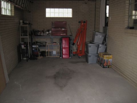 1979 Ford Bronco - This garage scene contains various tools and storage items, but no visible vehicle.