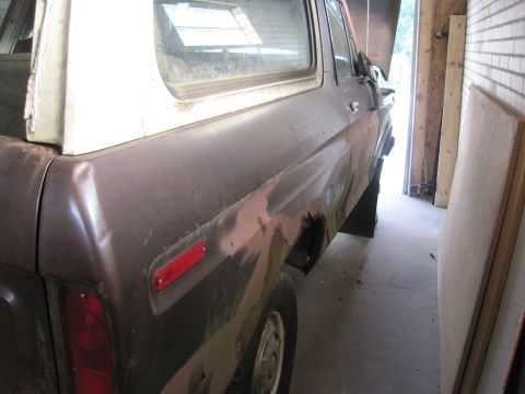 1979 Ford Bronco - This 1978 Ford Bronco is seen from the side, with visible rust and primer on its body.