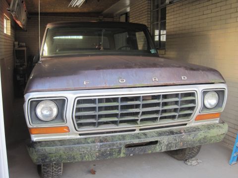 1979 Ford Bronco - Front view of a brown 1979 Ford Bronco parked inside a garage.