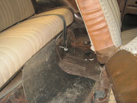 1979 Ford Bronco - Interior view of a vehicle's cabin, focusing on the seats and floor area.