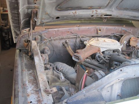 1979 Ford Bronco - The engine bay of a 1978 Ford Bronco shows significant rust and wear.