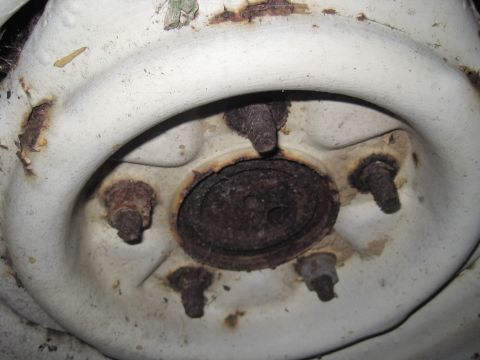 1979 Ford Bronco - The wheel hub shows significant rust and wear, indicating age and exposure.
