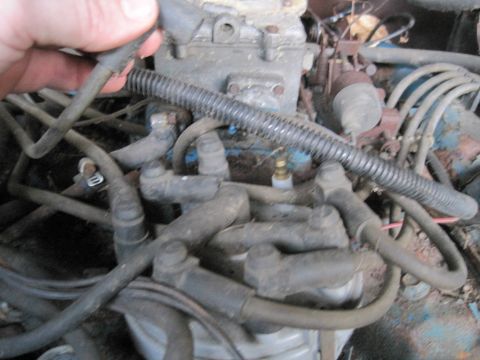 1979 Ford Bronco - Engine distributor and spark plug wires are visible in this close-up view.