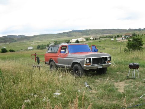 1978 Ford Bronco - This 1978 Ford Bronco is parked in a field, appearing to be in the process of being worked on.
