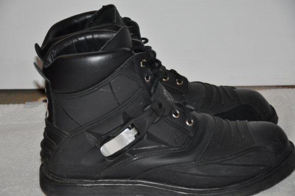 Pair of black motorcycle boots with buckles and laces