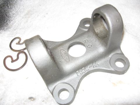 1995 Ford Bronco - Ford driveshaft yoke part F65W-AA with retaining clips shown on a white surface.