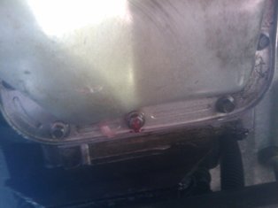 1993 Ford Bronco - Close-up of an oil pan with a Supermotors.net logo visible at the bottom.