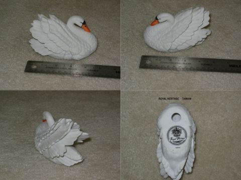 2004 Land Rover Land Rover - Ceramic swan figurine, likely a decorative item, with 'Royal Heritage Taiwan' text visible on the base.