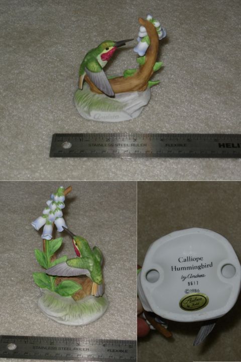2004 Land Rover Land Rover - A ceramic figurine of a hummingbird feeding from flowers is shown with a ruler for scale, and its base is visible.