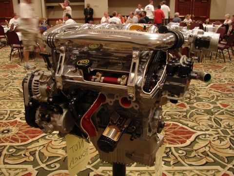 1992 Ford Taurus - A highly polished engine is displayed indoors, with a 'NOT TOUCH' sign attached.