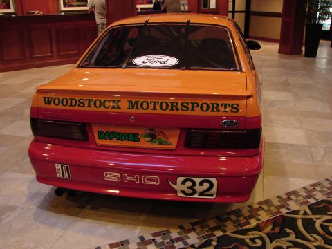 1992 Ford Taurus - This Ford Taurus SHO has 'Woodstock Motorsports' and 'Raphael' decals on its rear.