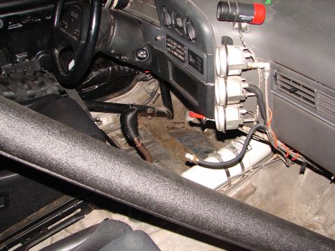 1992 Ford Taurus - Modified 1992 Ford Taurus interior shows racing gauges and safety equipment.