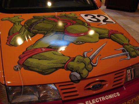 1992 Ford Taurus - Car hood features a custom graphic of Raphael from TMNT and the number 32.