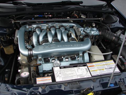 1992 Ford Taurus - Engine bay view of a Ford SHO 3.0L V6 engine, showing the intake manifold and other components.