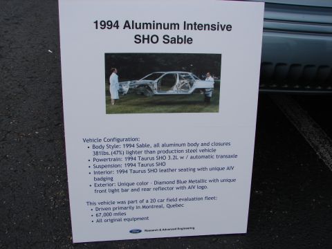 1992 Ford Taurus - A sign details the 1994 Ford Taurus SHO Sable prototype, highlighting its aluminum body and powertrain specifications.