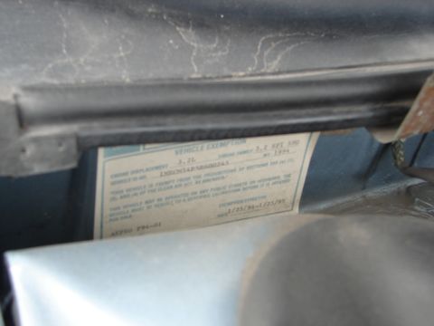 1992 Ford Taurus - A vehicle information sticker indicates the vehicle is a 1994 model with a 3.2L engine.
