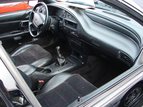 1992 Ford Taurus - The interior of a 1992 Ford Taurus shows cloth and leather seats, a floor shifter, and the dashboard.