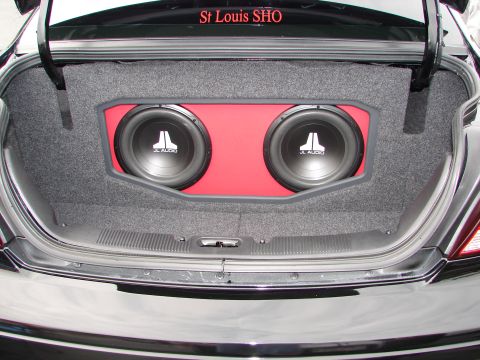 1992 Ford Taurus - Custom subwoofer installation in a car's trunk, two JL Audio speakers.