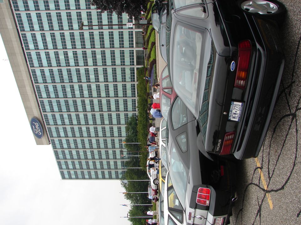 Black 1992 Ford Taurus wagon parked in lot, rear view, license plate KEM-220