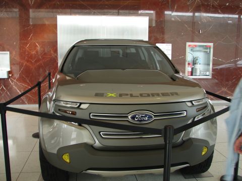 1992 Ford Taurus - A concept Ford Explorer SUV is displayed indoors, with "EXPLORER" text visible on its hood.