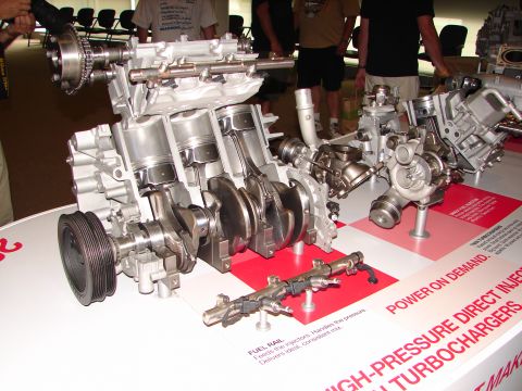 1992 Ford Taurus - A detailed cutaway of an engine assembly, highlighting its internal components and twin turbocharger system.